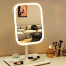 Espelho de maquiagem LED com controle touch, três tons de iluminação e base organizadora para cosméticos, ideal para penteadeira e cuidados diários.