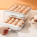 Organizador de ovos empilhável transparente com gavetas deslizantes para geladeira, ideal para armazenar ovos de forma segura e economizar espaço.