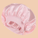 Touca de Cetim Premium para Dormir na cor rosa, com elástico confortável, ideal para proteger os cabelos, reduzir o frizz e preservar a hidratação dos fios durante o sono.